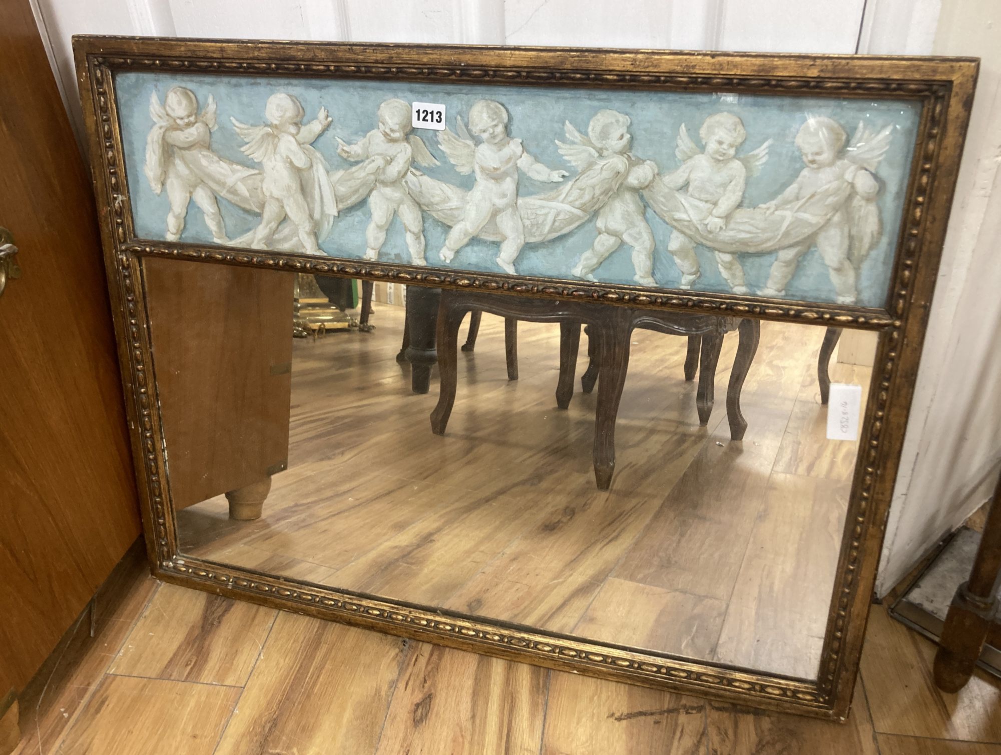 A wall mirror with painted cherub panel, width 78cm, height 62cm